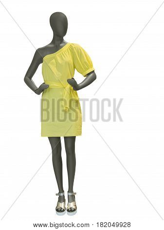 Full-length female mannequin dressed in yellow dress isolated on white background.