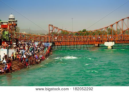 Haridwar, India - 2nd Apr 2017 : Crowds on the banks of the river Ganga at Har ki Pauri. This is one of the most holy places in Hinduism. Place to wash away sins.