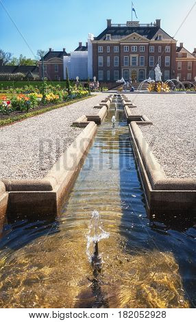 Apeldoorn, The Netherlands - May 8, 2016: Dutch baroque garden of The Loo Palace a former royal palace and now a national museum located in the outskirts of Apeldoorn in the Netherlands