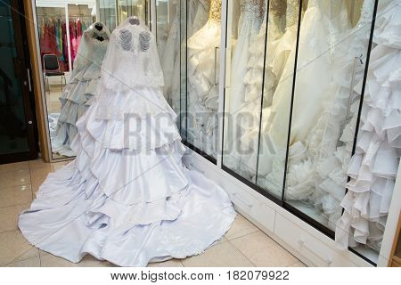 white wedding dress gown on mannequin in bridal gown. Bride's morning wedding preparation concept