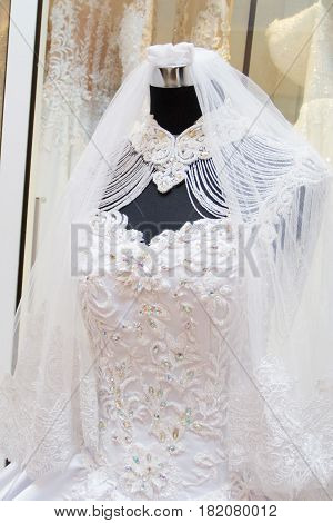 white wedding dress gown on mannequin in bridal gown. Bride's morning wedding preparation concept