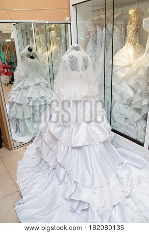 white wedding dress gown on mannequin in bridal gown. Bride's morning wedding preparation concept