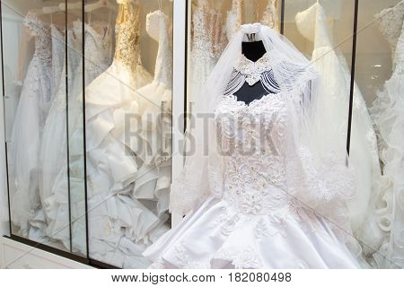 white wedding dress gown on mannequin in bridal gown. Bride's morning wedding preparation concept