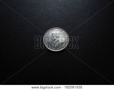 Vintage and antique Australian silver One Shilling coin.