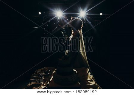 Happy Wedding Couple Tasting Together Wedding Cake. Happy Bride And Groom Eating Rustic Cake And Kis