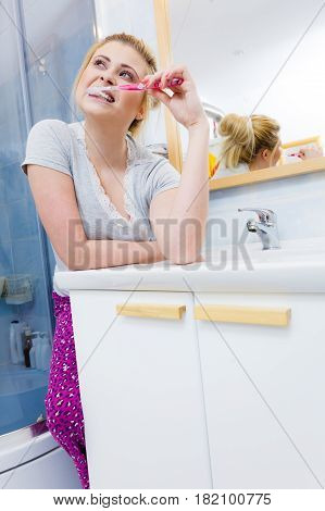 Woman Brushing Cleaning Teeth In Bathroom