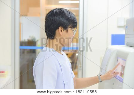 Asia scientist working in white lab hopital