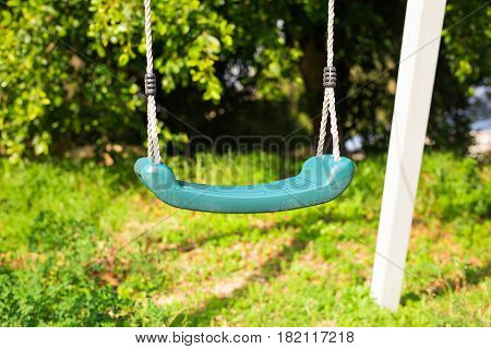 Children swing in the park at Playground