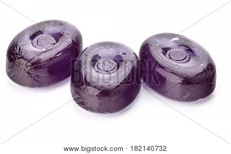 Three colorful fruit hard sugar candies,  boiled sweeties or sugar plums isolated on white background cutout
