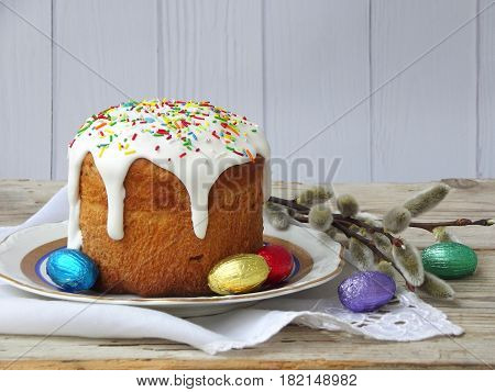 Easter Composition Of Sweet Bread, Paska And Eggs On Wooden Background. Orthodox Kulich. Holidays Br