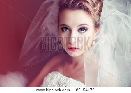 A Blurred Picture Of A Stunning Blone Bride With Sparkling Veil
