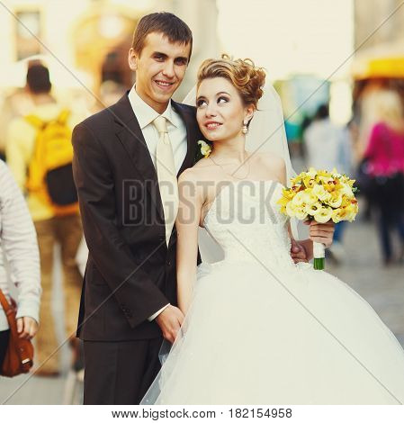 Bried Looks At A Groom With Love Posing On The Street
