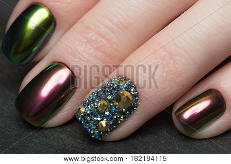 Beautifil Colorful manicure with rhinestone. Nail Design. Close-up.