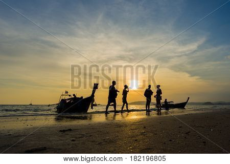 Ao Nang Krabi Thailand - March 02 2017: People on the Ao Nang beach at sunset in Krabi province Thailand