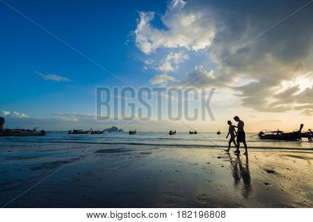 Ao Nang Krabi Thailand - March 02 2017: People on the Ao Nang beach at sunset in Krabi province Thailand