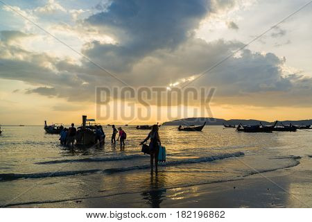 Ao Nang Krabi Thailand - March 02 2017: People on the Ao Nang beach at sunset in Krabi province Thailand