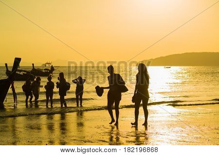 Ao Nang Krabi Thailand - March 02 2017: People on the Ao Nang beach at sunset in Krabi province Thailand