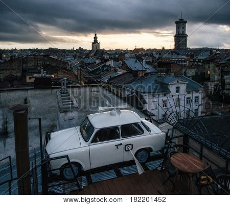 Lviv, Ukraine - September 22, 2016: Trabant car parked on the roof a historic building House of Legends - famous cafe, landmark and travel destination of Lviv, Ukraine.