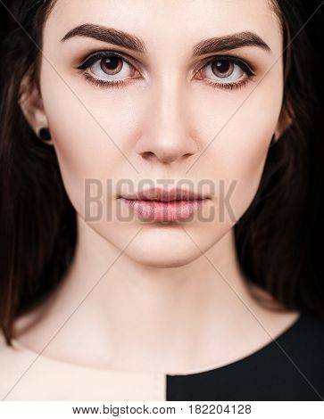 Close-up portrait of young beautiful woman's face with eloquent eyes.