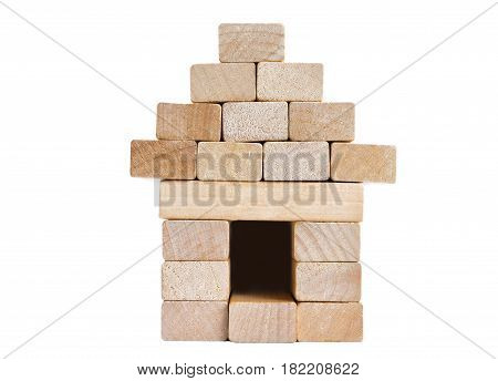 A house with a fence made of wooden blocks