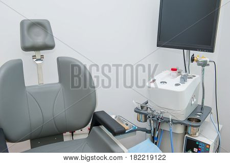 Interior Of Modern Ent Clonic. Professional Evo Ent Medical Devices Workstation And Chair In Office.