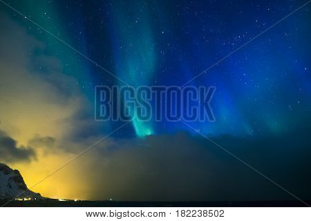 Aurora Borealis Known as Nother Lights Playing with Vivid Colors Over Lofoten Islands in Norway. Horizontal Image