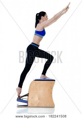 one caucasian woman exercising fitness pilates exercices isolated on white background