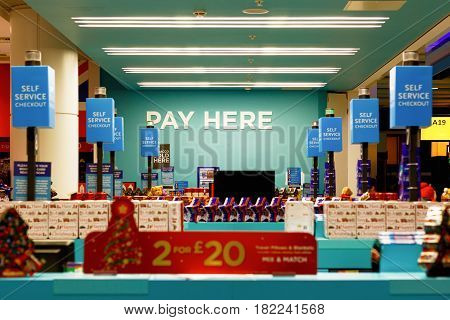 London UK - December 24 2016 - Duty free shop at Heathrow Airport with signs of PAY HERE and SELF SERVICE CHECKOUT