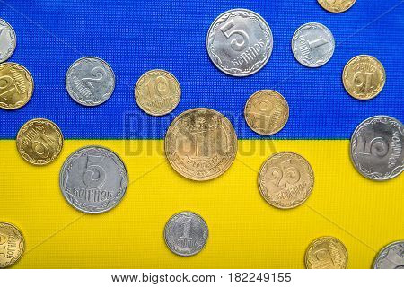 Ukrainian national coins against the background of the national flag. Eurovision currency