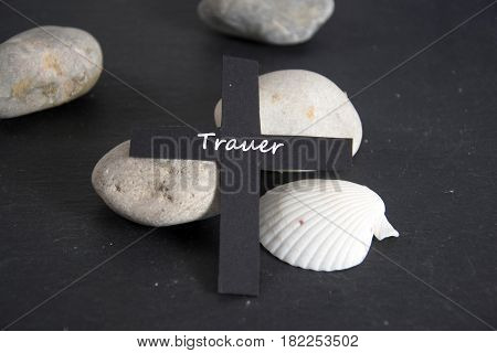 Trauer - german for dolefulness - written on a black cross