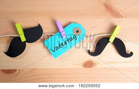 Vatertag  -  german for father`s day - written on a paper tag