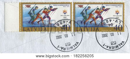GOMEL, BELARUS, APRIL 17, 2017. Stamp printed in Latvia shows image of  The 2002 Winter Olympics, officially the XIX Olympic Winter Games and commonly known as Salt Lake 2002, circa 2002.