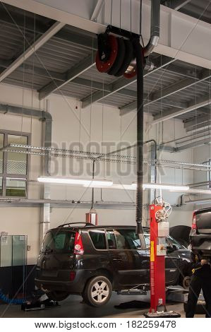Modern automobile service station with fumes exhaust vetillation unit