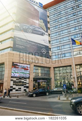 BUCHAREST ROMANIA - APR 1 2016: Luxury Gambling house casino The Platinum Casino on the Calea Victoriei at the Radisson Blu hotel - luxury Mercedes-Benz limousines parked outside and businessmen's entering the casino