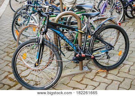 STRASBOURG FRANCE - FEB 13 2017: Modern BTWIN bike parked in city center parking - B'Twin ins a brandy by Decathlon is one of the world's largest sporting goods retailers.