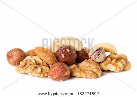 Heap from various kinds of nuts almond walnut hazelnut cashew Brazil nut isolated on white background.