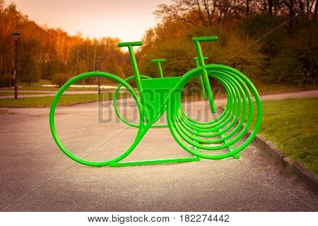 Parking space for bicycles outside in the park on spring day