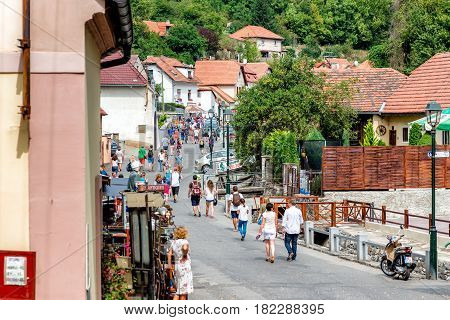 KARLSTEJN CZECH REPUBLIC - SEPTEMBER 03 2016: Main village street leading to Karlstejn Castle. Karlstejn Village Central Bohemia Czech Republic.