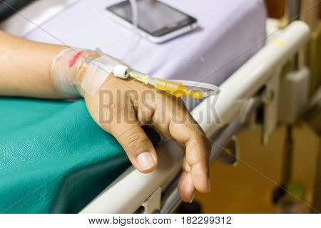 Give the patient's saline solution to the wrist.