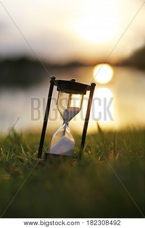 Vintage hourglass in the dawn time (Vertical)