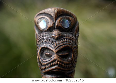 New Zealand Maori Carving of Face with Paua Eyes