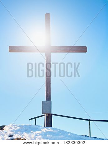 Modest Wooden Cross On Rocky Summit. Memory Of Victims