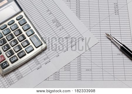 Gold coins lie in the man`s palms. Top view, on a light wooden background