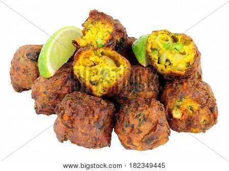 Group of fried vegetable pakora with chilli sauce dip isolated on a white background