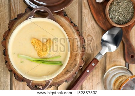 Delicious cream soup on table, top view