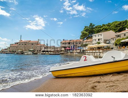 PETROVAC, MONTENEGRO - SEPTEMBER 20, 2016:The old town of Petrovac with an ancient fortress and a bay for tourist and fishing vessels, Montenegro.