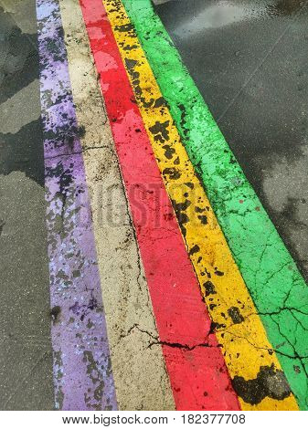 Abstract colorful stripes on the asphalt