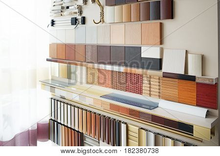 Furniture fittings multicolored chipboard panels close-up background laminated chipboards color palette texture furniture sample parquet boards in hardware store in home improvement warehouse exterior