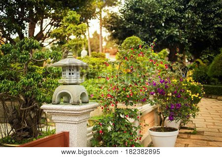 Buddhist monastery Chua Truc Lam in Da Lat, Vietnam. Dalat's famous landmark, buddhist temple. Decorative pagoda in the garden. Colorful horizontal image