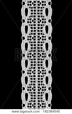 White vintage lacy decorative ribbon on black background